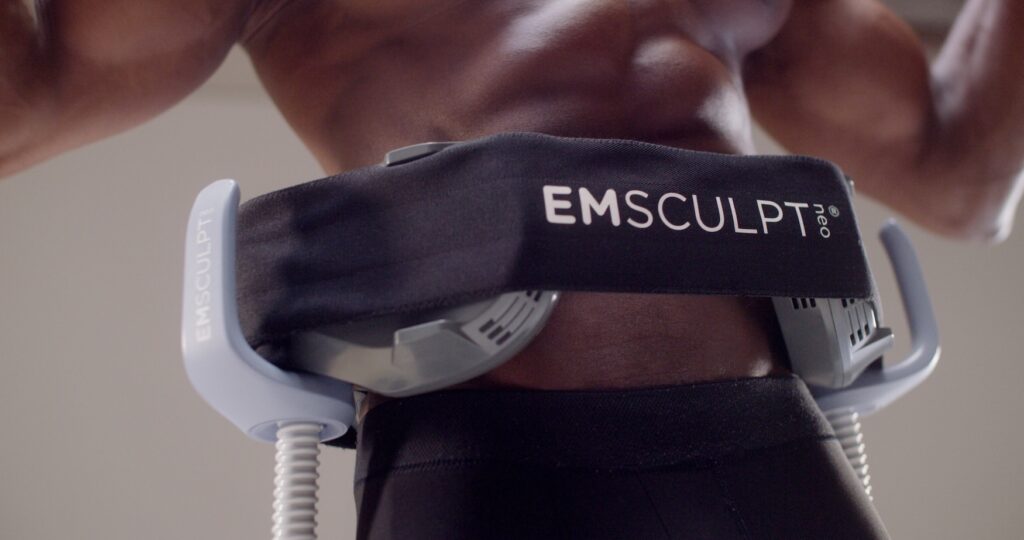 Man receiving Emsculpt NEO body sculpting treatment on his abdomen at Elite Healthcare Partners in Lake Worth, FL.